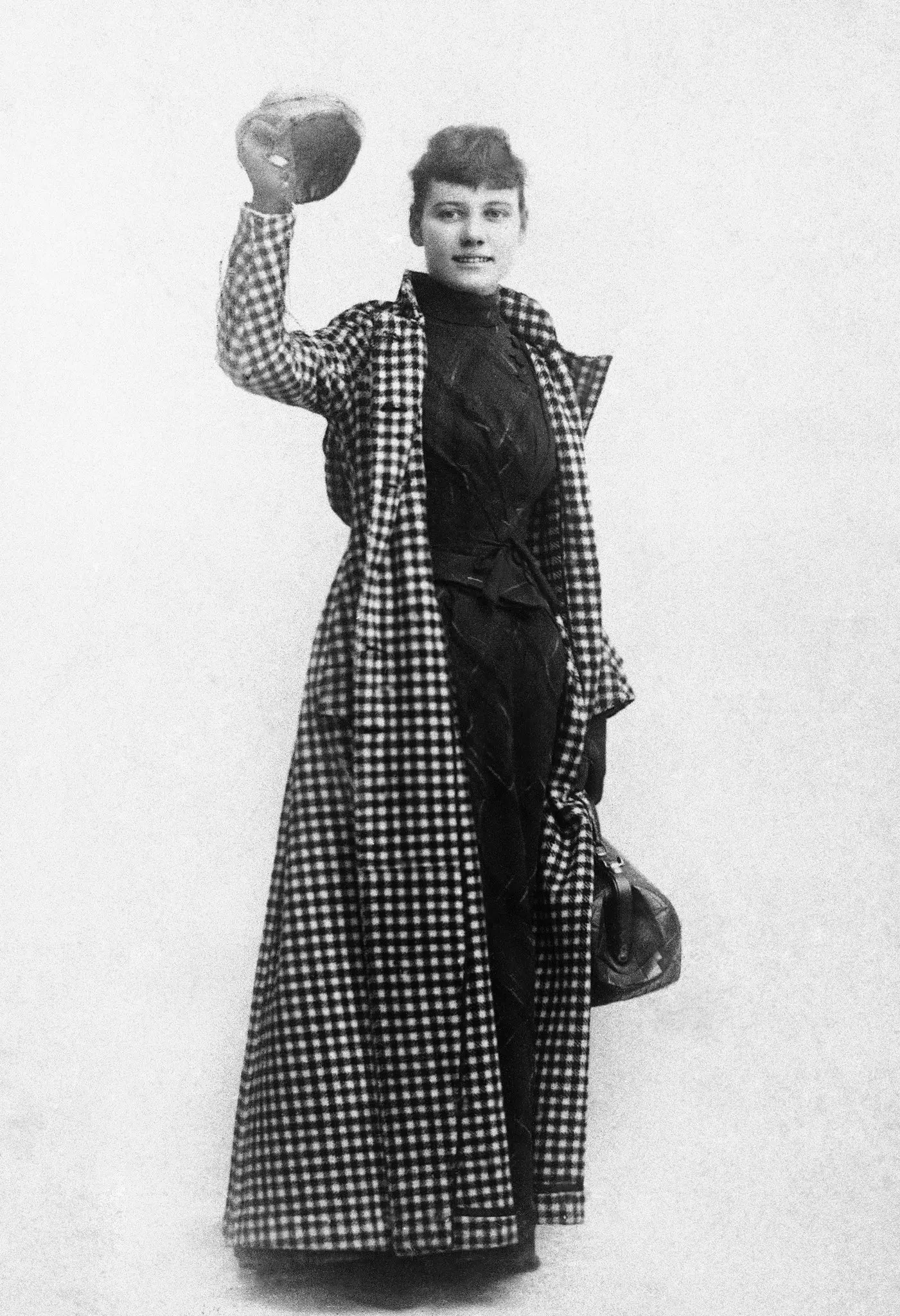 Nellie Bly with all she brought on her 72 -day trip around the world.