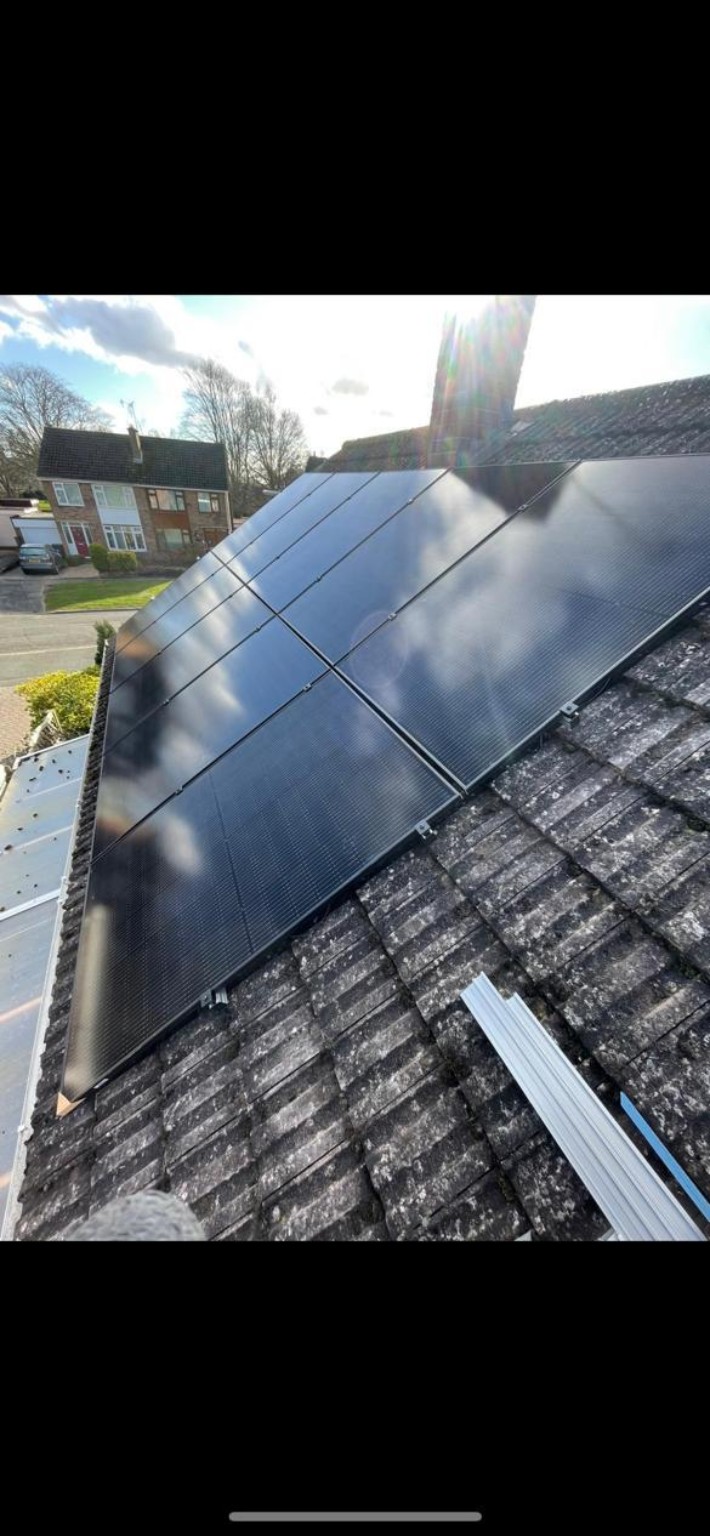 All-black solar panels on tiled roof