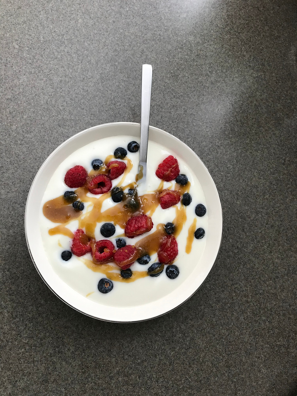 Cannabis Honey Drizzled over Fresh Berries in a Bowl of Vanilla Yogurt Stoner Strategies