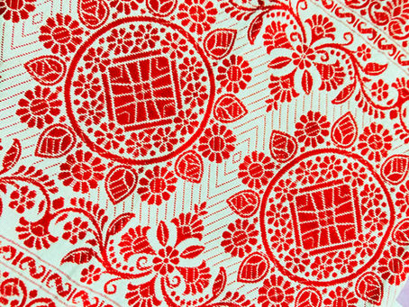 Elegant Assamese Gamosa Pattern in Textiles of Assam