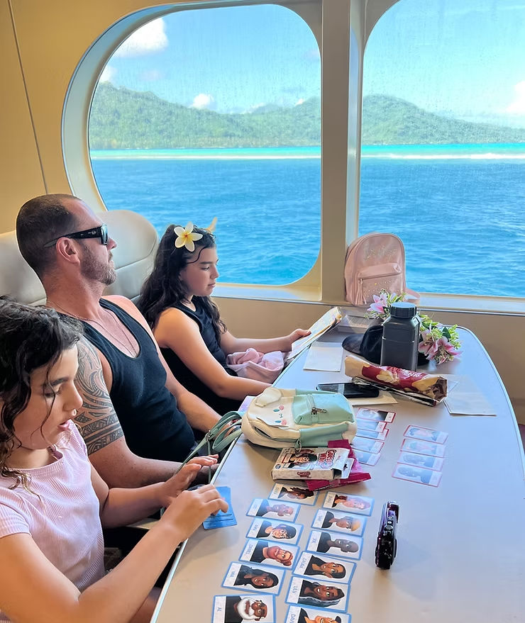 Family travelling on a ferry in French Polynesia