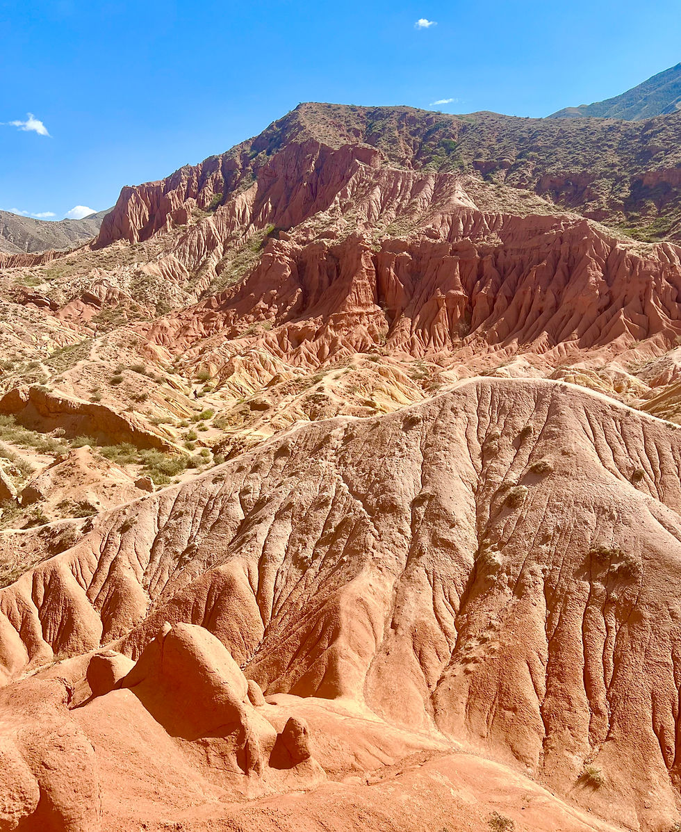 The bright orange and red cliffs of Skazka Canyon,  Kyrgyzstan.