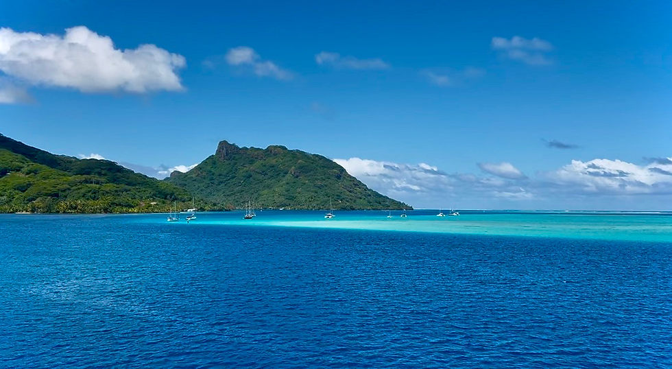 Turquoise and blue water in front of Huahine Island, French Polynesia