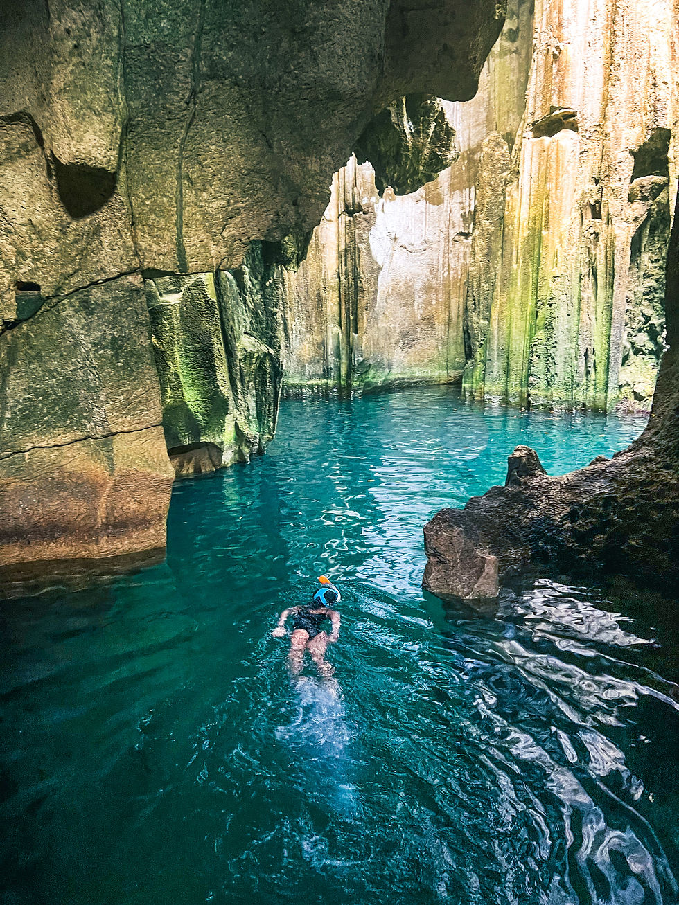 Child swimming in Sawa-i-Lau Caves, Fiji