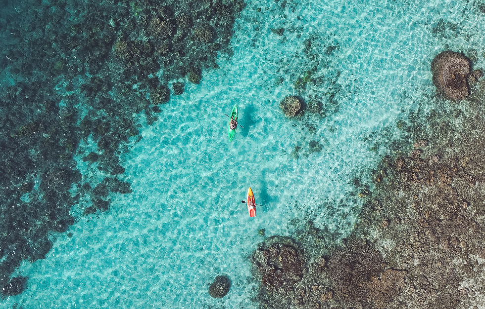 kayaking over blue water and reefs in Vanuatu
