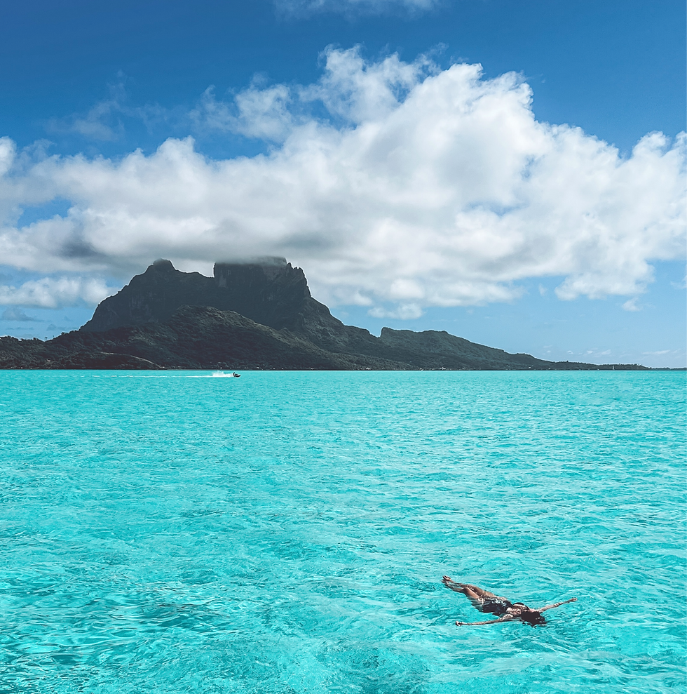Lady floating in Bora Bora