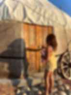 Little girl entering a yurt in Kyrgyzstan