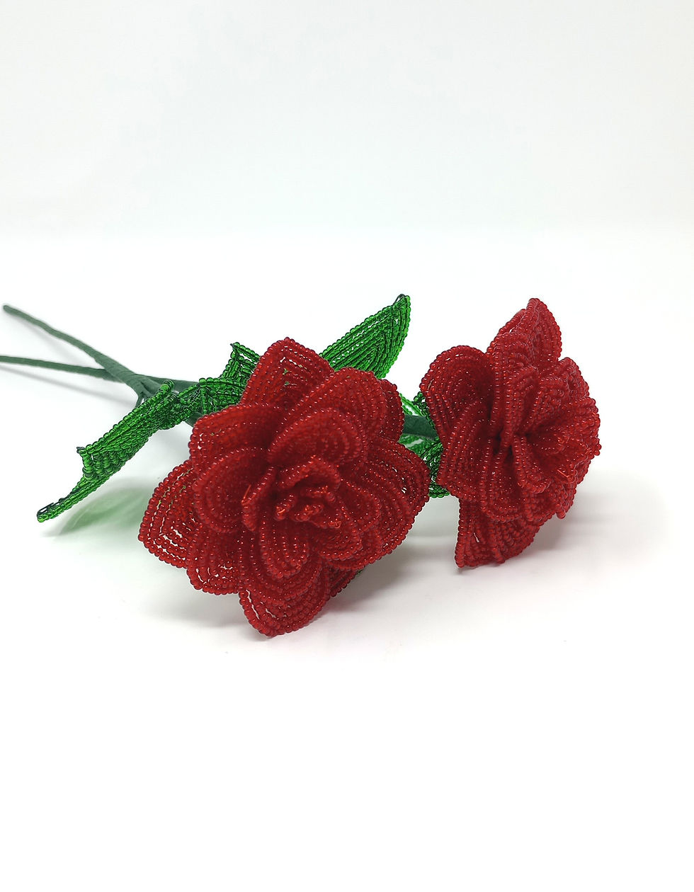 Thumbnail: Handcrafted single stem French beaded rose in red with green leaves.  Stem length is 11".