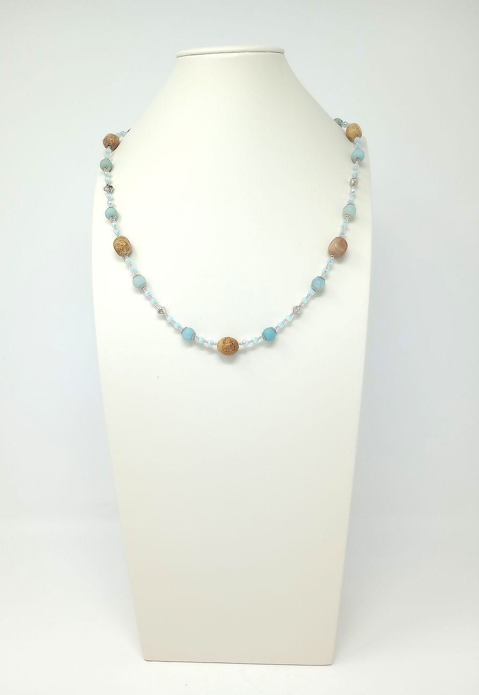 Handcrafted necklace of light blue amazonite and tan fossil coral gemstones, blue crystals and silver tone beads