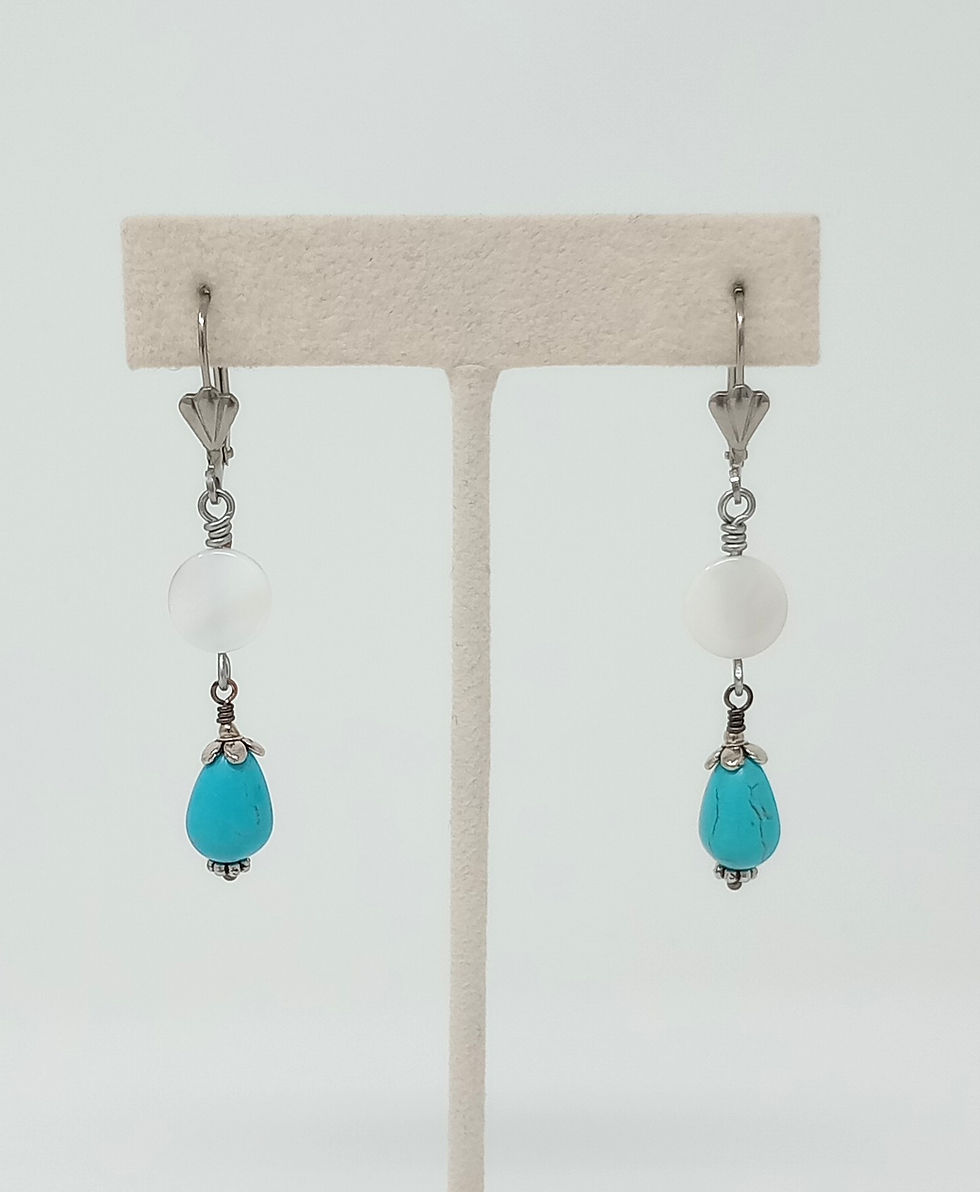 Casual earrings of mother of pearl and turquoise howlite drops. Silver tone leverback earwires with shell motif