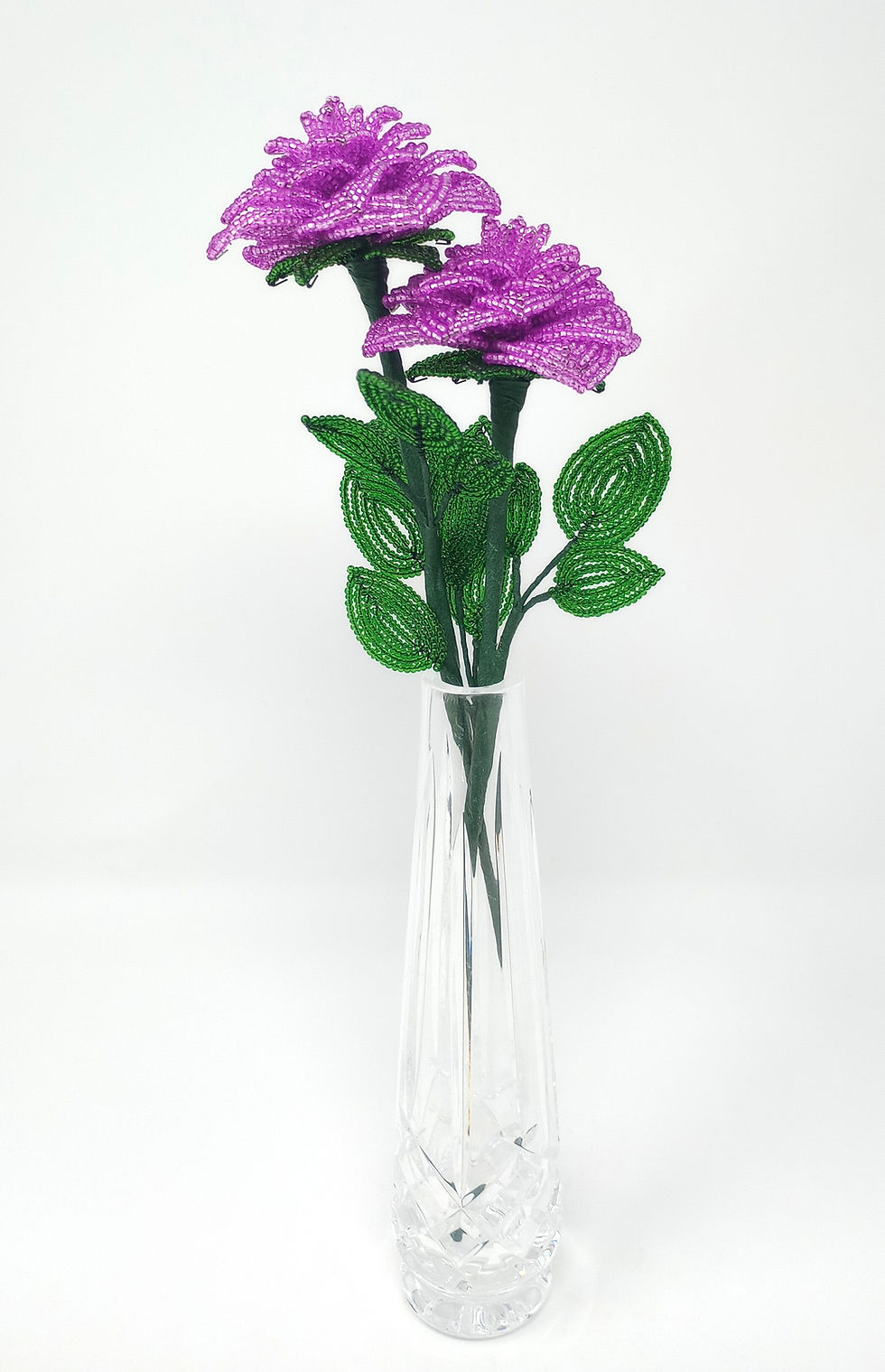 Thumbnail: Handcrafted single stem French beaded rose in silver lined dark purple with green leaves.  Stem length is 11".