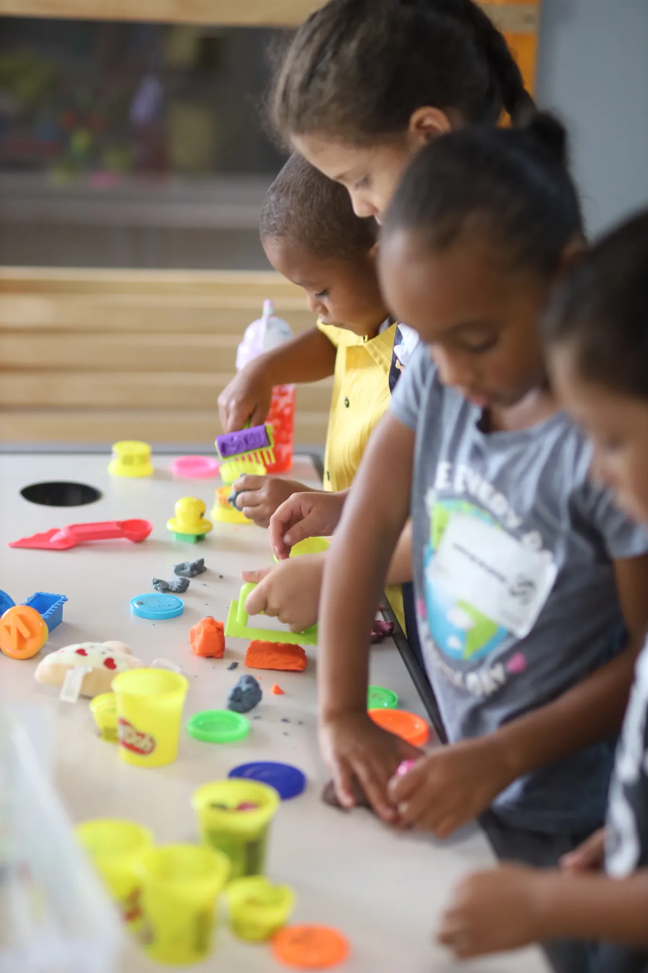 Children working with colorful play materials