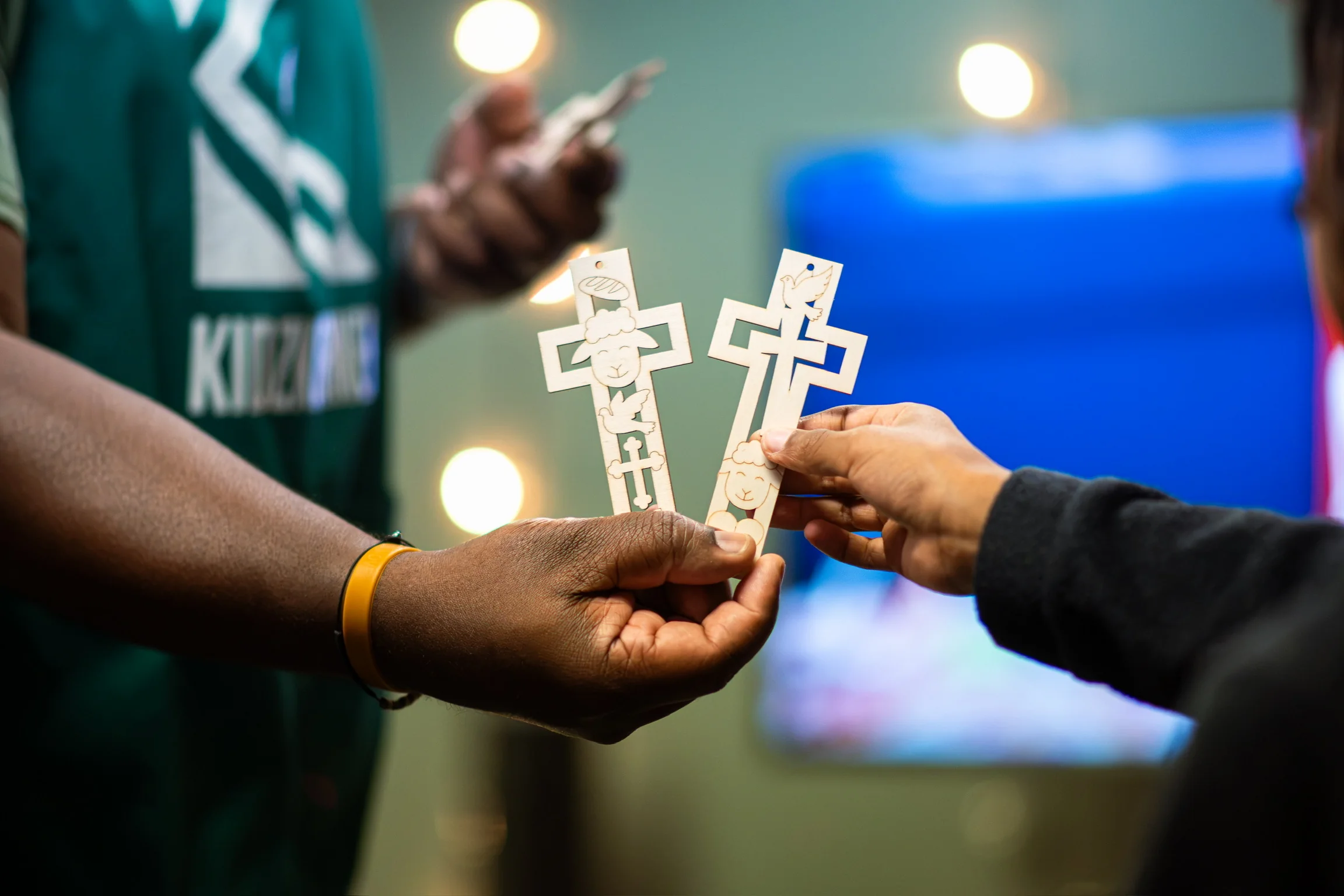 Children exchanging handmade cross crafts