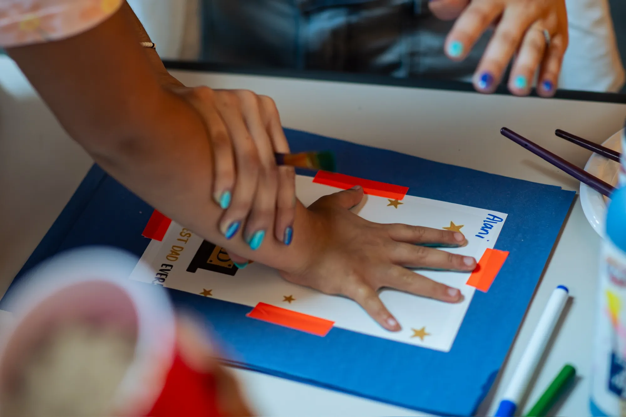 Children assembling a faith-based craft together