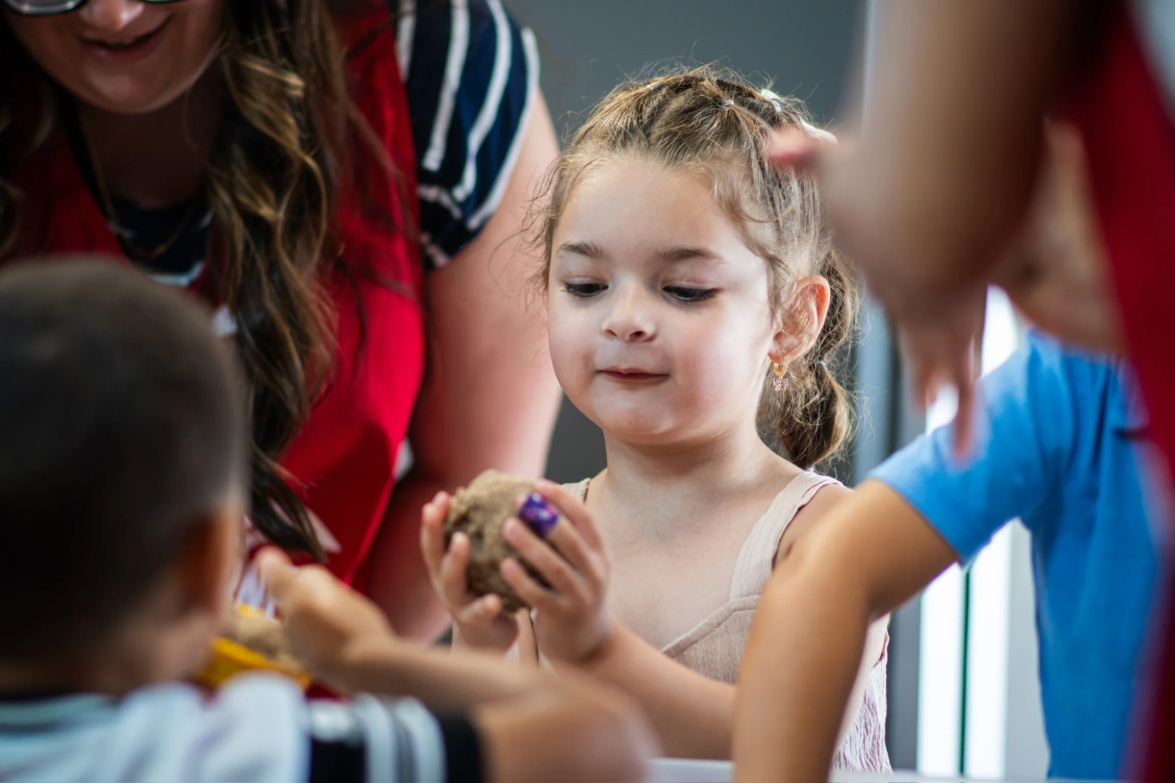 A child participating in a bright Kidz Korner craft activity
