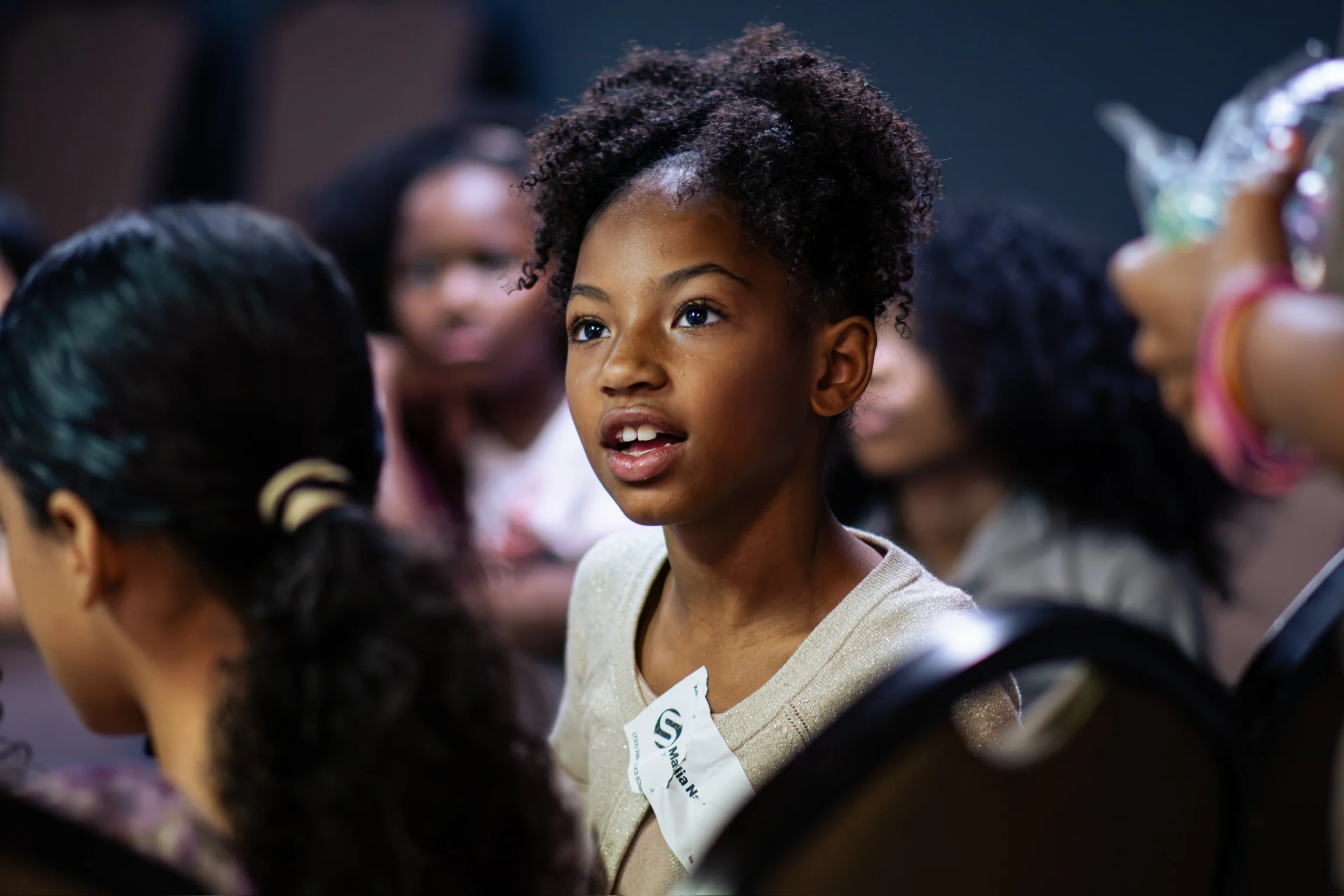 A child listening during a Kidz Korner gathering