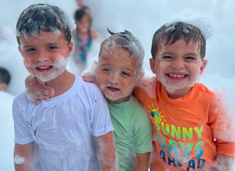 Children playing at foam machine rental party in Boise