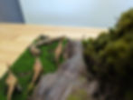 Dinosaur figures in a Galli-Trex Ambush diorama scene