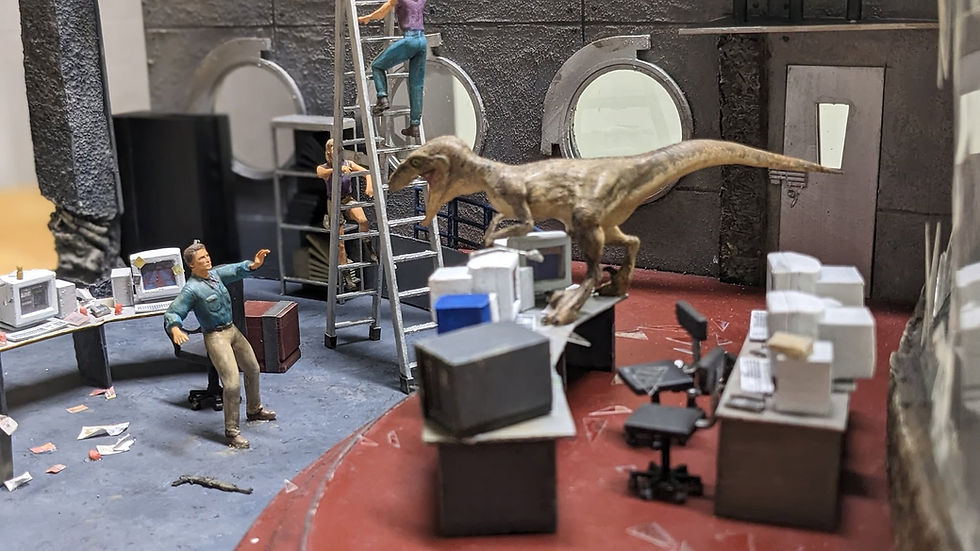Dinosaur figurine in a miniature control room diorama.