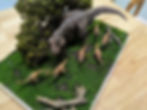Diorama of a T-Rex stalking Gallimimus in a forest