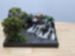 Diorama of Dennis' death scene with Jeep and waterfall