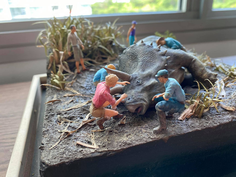 Diorama of people tending to a sick Triceratops