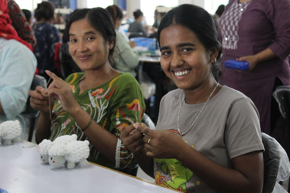 Women crocheting lambs for outflow world outreach