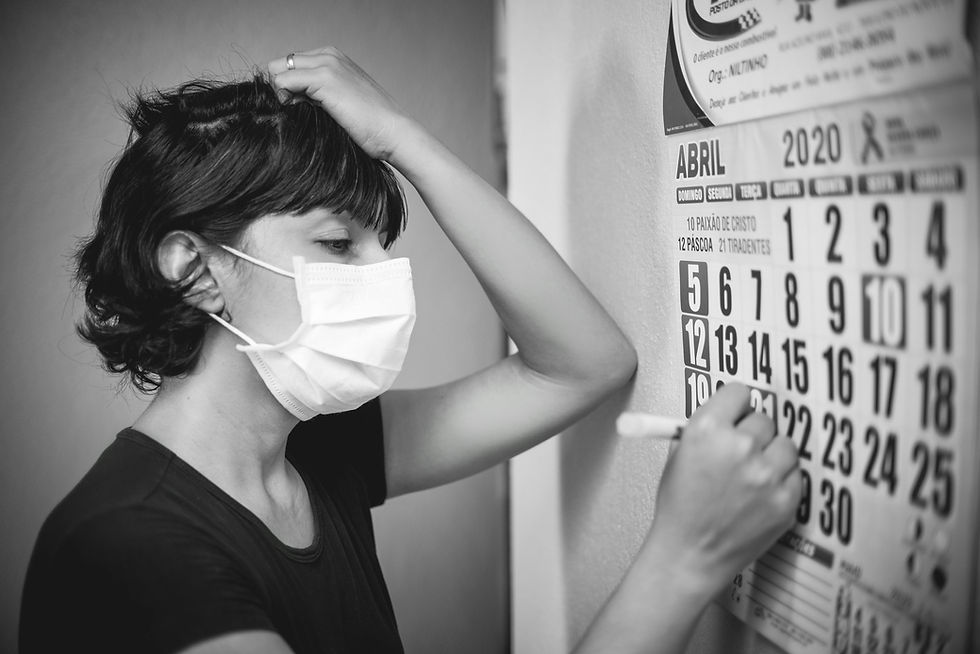 Person in mask marks calendar.
Illustrating mental health days in a year