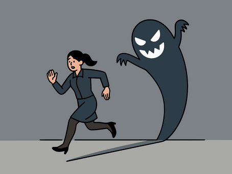 A woman runs from a shadowy ghost with a menacing face in a gray setting, conveying fear and panic attacks.