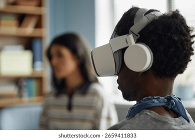 Person wearing a VR headset and headphones indoors, with a blurred woman in the background illustrating mental health activities for families.