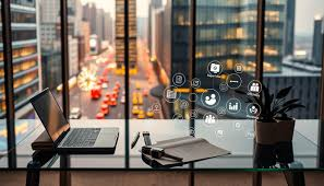 Laptop on glass desk with open notebook and pen. Office window view shows blurred cityscape and traffic. Digital icons hover above.