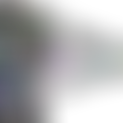 Abstract colorful pixel streaks on a black background, forming a sharp arrow-like burst to the right.