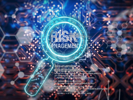 Glowing magnifying glass over circuit board with "RISK MANAGEMENT" text. Futuristic digital theme with blue and orange hues.