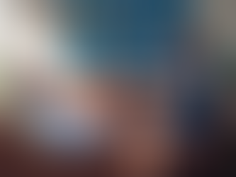 Man on a couch talking to a psychiatrist taking notes.