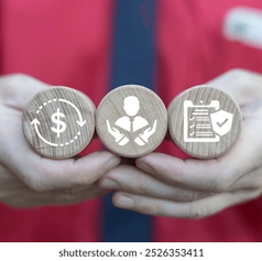 Hands in a red shirt hold three wooden coins with dollar, business, and checklist shield icons; Illustrating EAP MEANING
