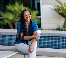 Shamirrah Hill taking a break from work and enjoying a cup of coffee
