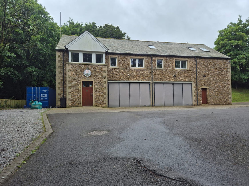Large stone cottage house with premium slate roofing work in Keswick