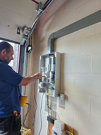 man at fuse box