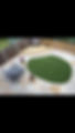 large garden with centre grass and patio