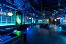 neon-blue-nightclub-lounge-with-bar-vip-seating-and-disco-balls.webp