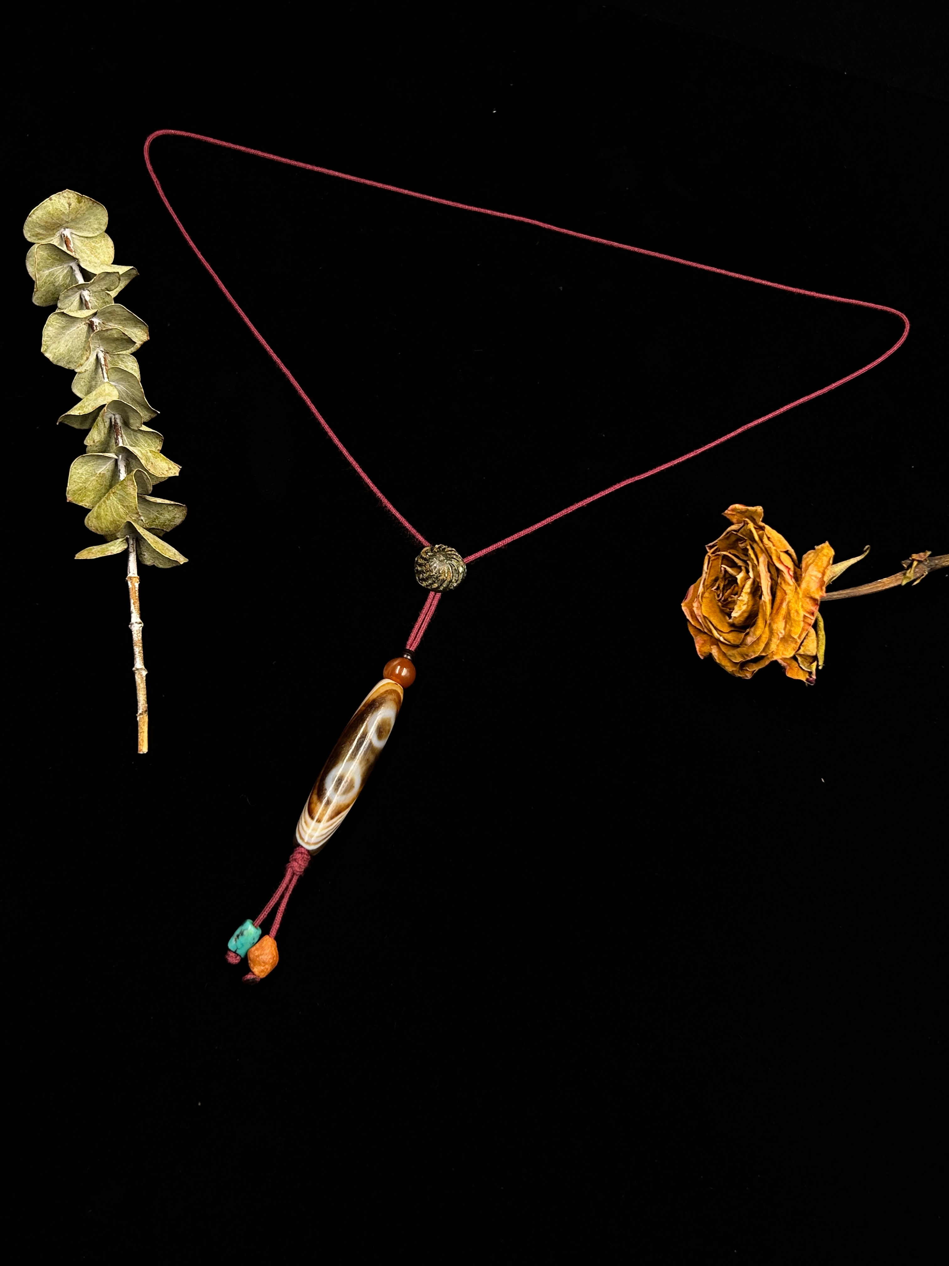 Freeform-lined Cuo Si old Dzi bead with Star-and-Moon two-eyed pattern