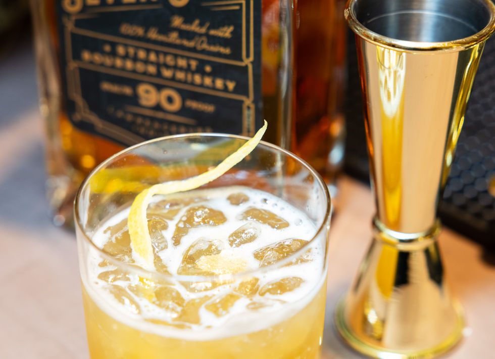 Gold rush cocktails served at the bar at luxury event.