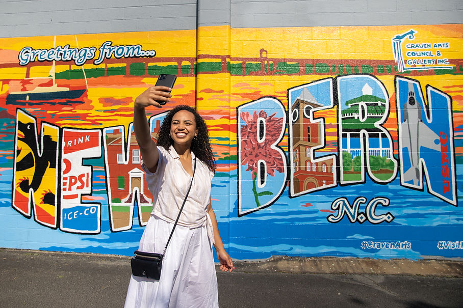 Woman in front of New Bern mural.jpg