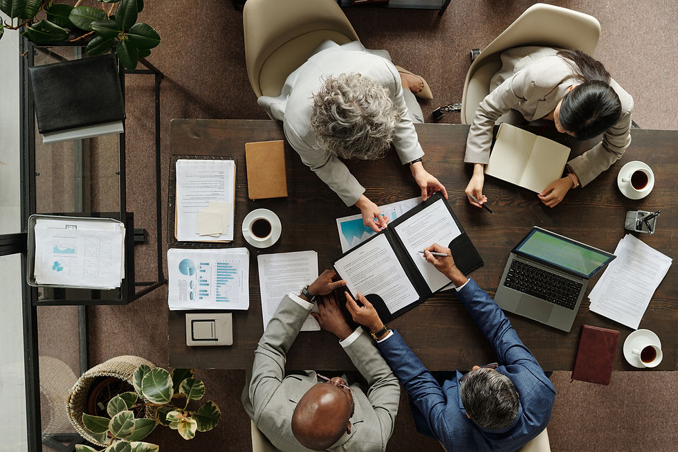 An aerial view of 4 people in a meeting.