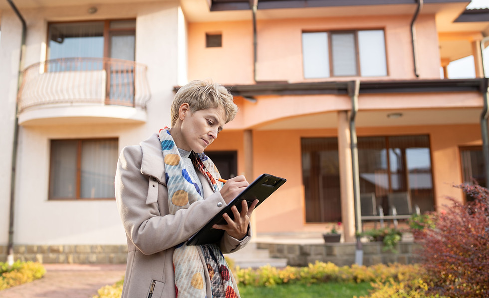 Woman standing in front of house with a checklist.