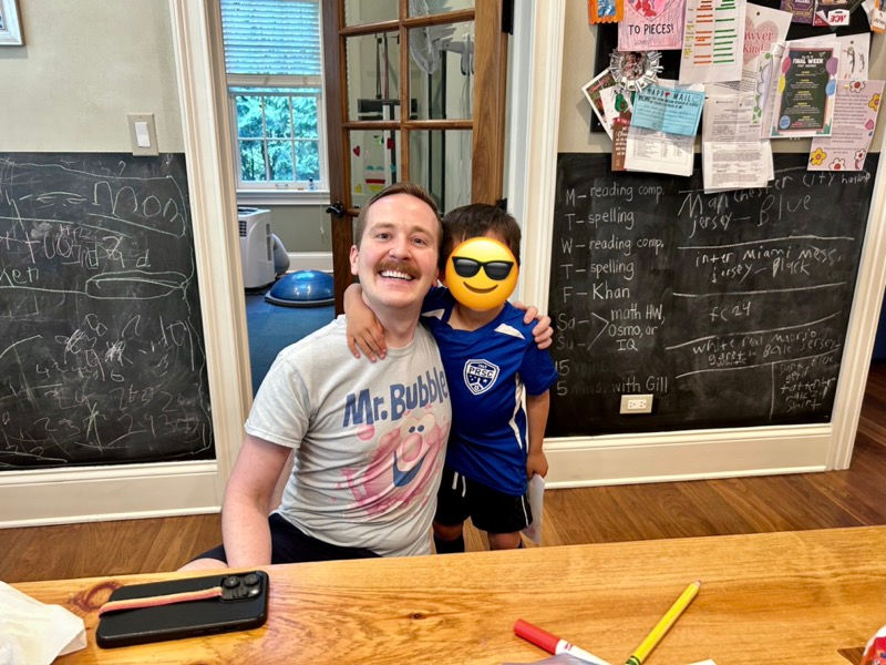 Mr. Wilson is posing with his client who had just finished his in-home speech therapy session.