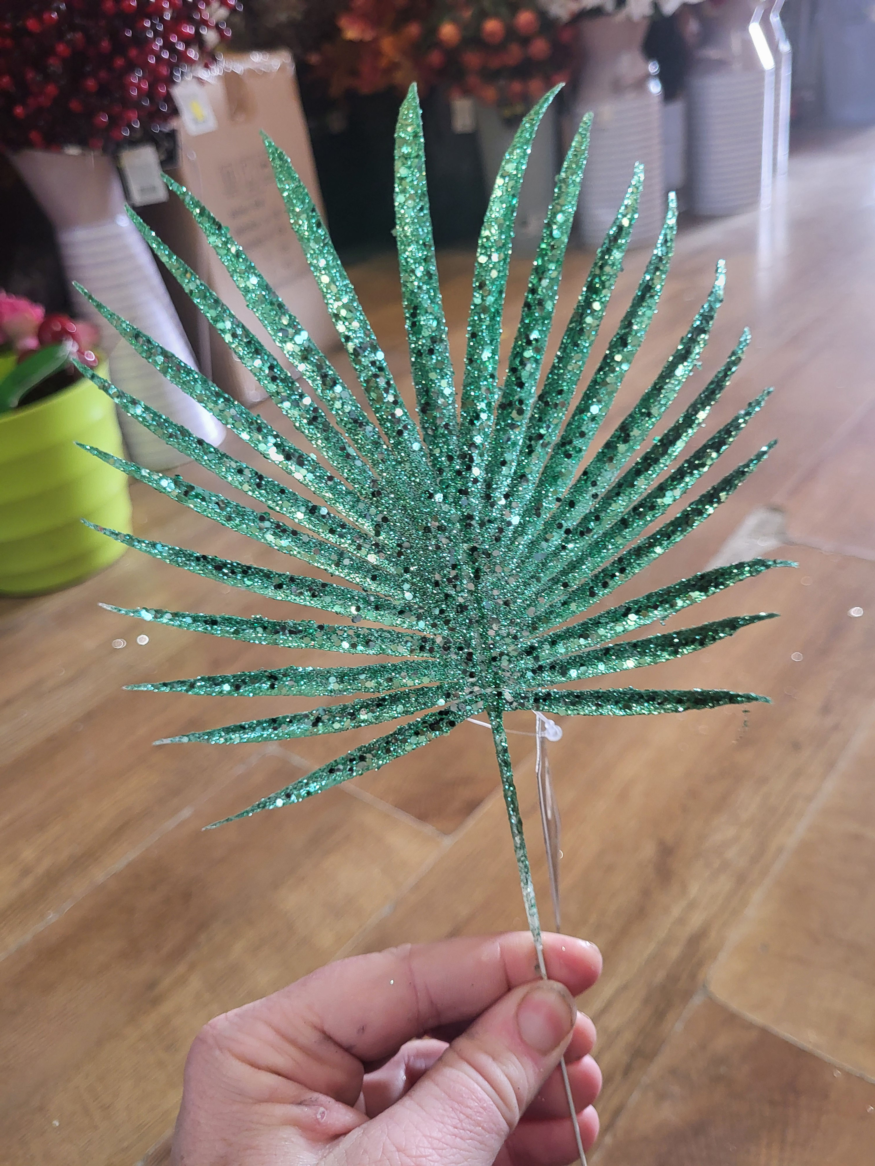 Green glittered palm leaf pick