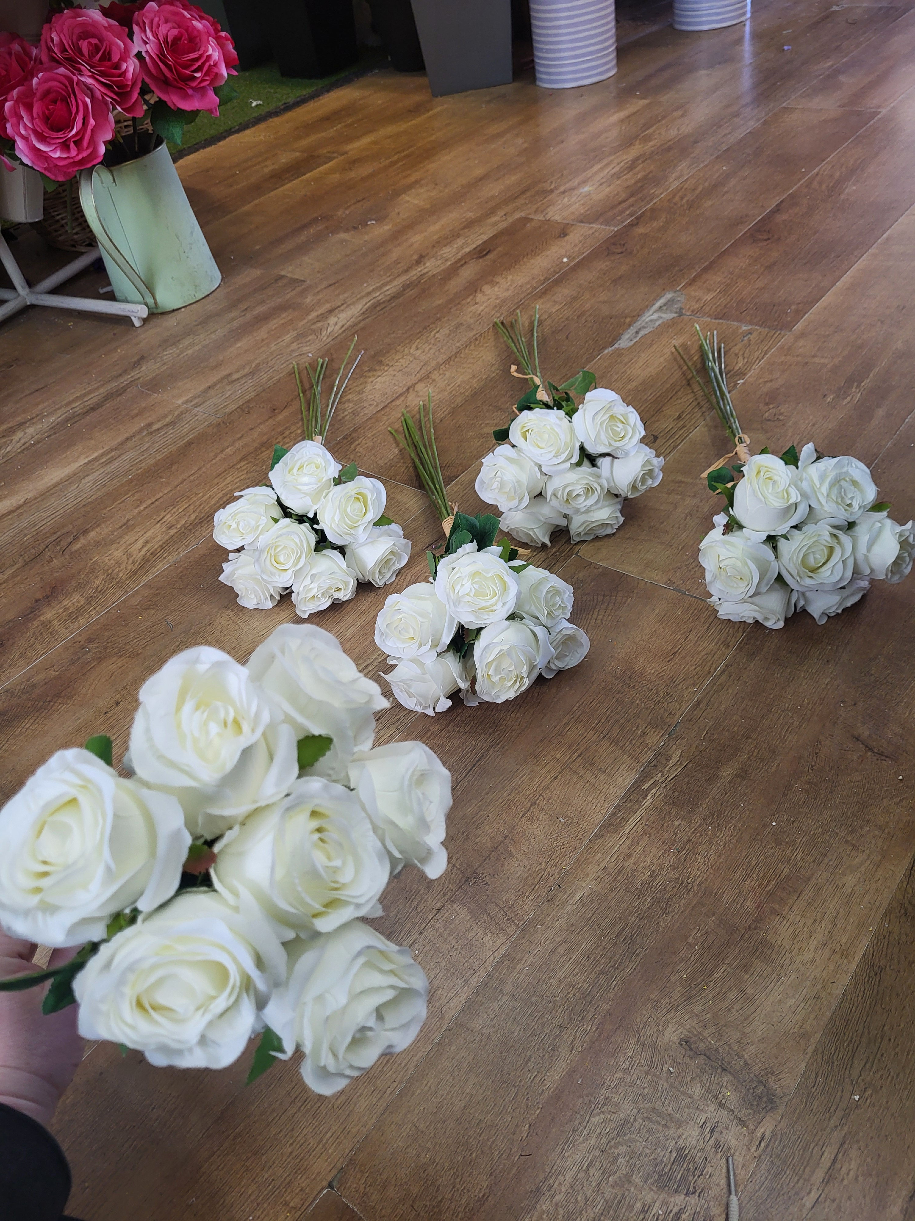 5 bunches of hand tied bundles of 7 ivory long stem roses