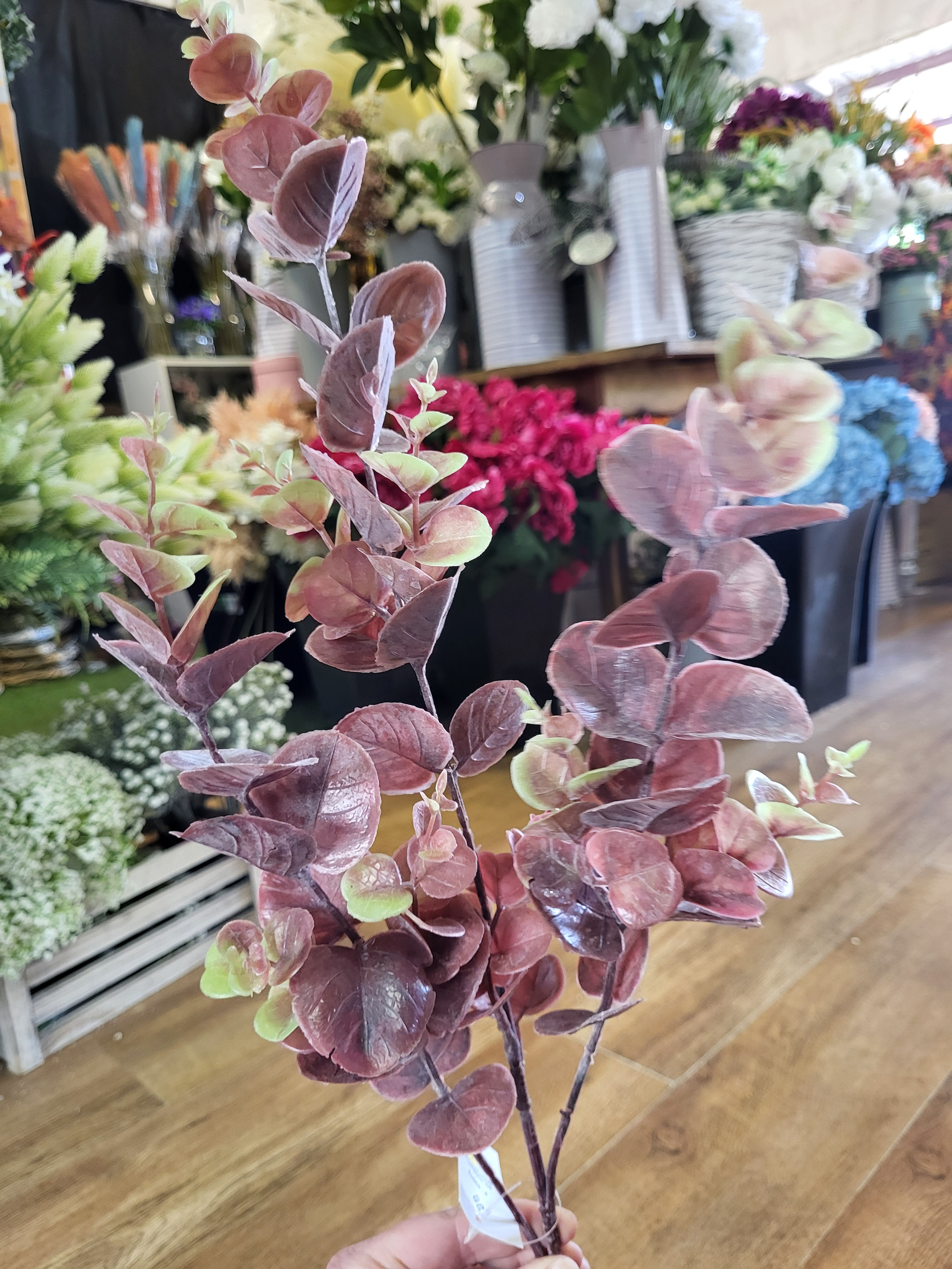 Long stem plastic Reddish brown eucalyptus spray 