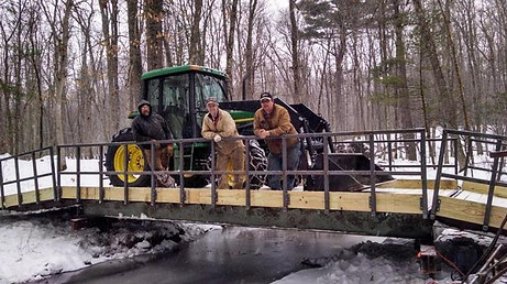 A newly built bridge over a creek.